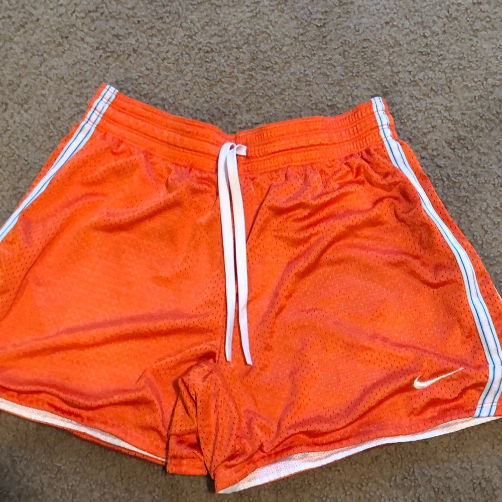 Orange Nike dri fit athletic shorts